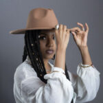 woman in a brown hat